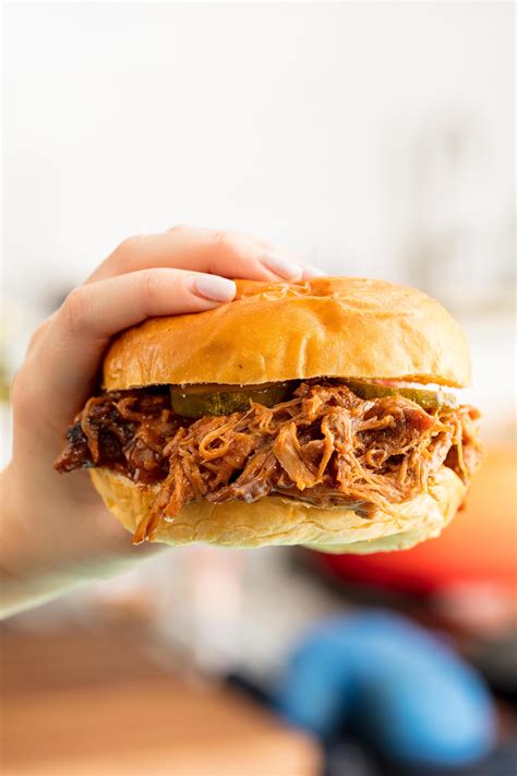 Do you put liquid in slow cooker for pulled pork?